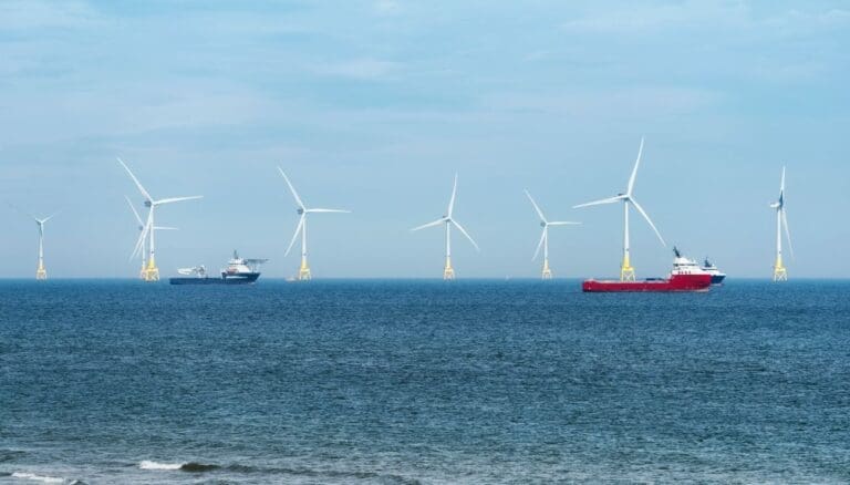 Windmills on the sea with boats - RA-ESG